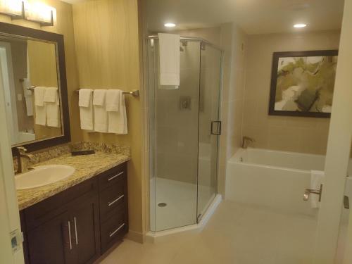 a bathroom with a shower and a sink at 1 bedroom condo F1 / Superbowl Availability in Las Vegas