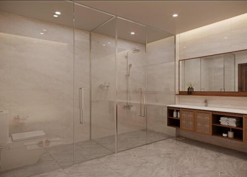 a bathroom with a shower and a toilet and a sink at The Hub by Hotel Academy Phu Quoc in Phú Quốc