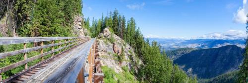 a bridge on the side of a mountain at Tranquil Retreat Spacious 2-Bedroom on a Serene Acreage in Kelowna