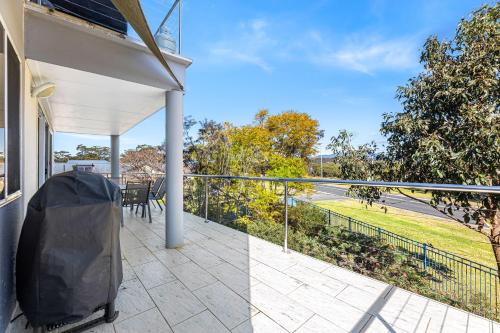 an outdoor balcony with a view of a road at Unit 9, Boardwalk Apartments in Narooma