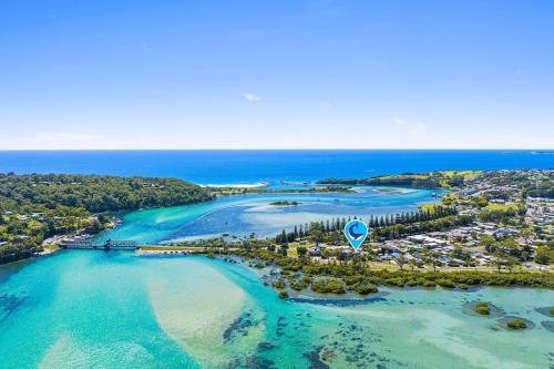 an aerial view of a beach with a resort at Unit 9, Boardwalk Apartments in Narooma