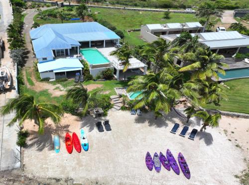 an aerial view of a resort with surfboards and beach chairs at Studio Stmartin in Cul de Sac