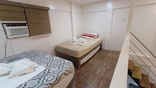 Ein Bett oder Betten in einem Zimmer der Unterkunft FB DORMITEL SUITES