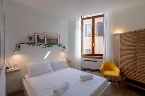 Un pat sau paturi într-o cameră la La Promenade