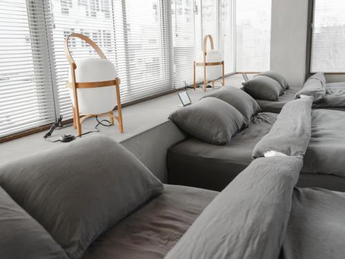 a group of pillows lined up in a room at Bstudio in Wakayama