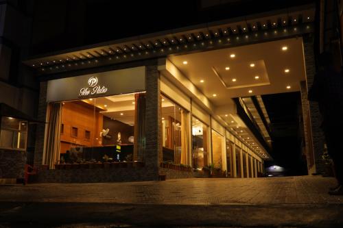 a store front of a store at night at The Patio Thekkady in Thekkady