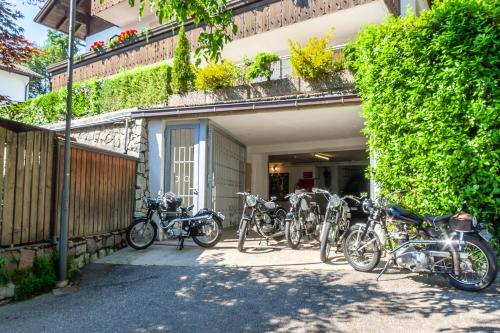 a group of bikes parked outside of a building at Pension Kofler in Vollan