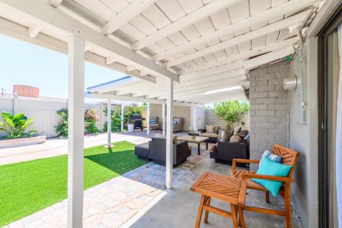 a white pergola on a patio with furniture at Disneyland Dream Villa 5 BR 3 BA Arcade Games in Anaheim