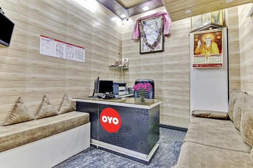 a lobby with a desk with a computer on it at OYO Sun Shine Hotel Laxmi Nagar in New Delhi