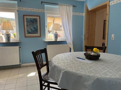 a dining room with a table with a white table cloth at Schönbachhof in Silz
