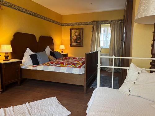 a bedroom with a large bed and a window at Schönbachhof in Silz