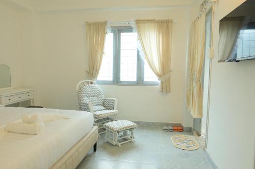 Postel nebo postele na pokoji v ubytování LA VIE EN ROSE 2 Hotel