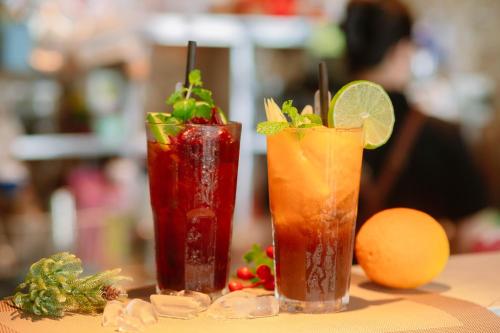 three cocktails sitting on top of a table at Seaside Resort Vung Tau in Vung Tau