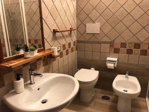 a bathroom with a sink and a toilet at The House of the poet in Civitavecchia
