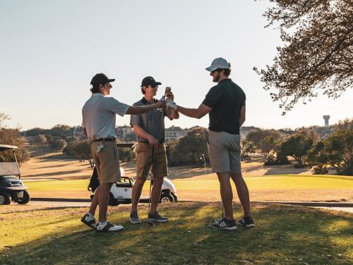 a group of three men shaking hands on a golf course at VACATION MARBELLA I Aldea Blanca, Luxury Duplex, Sea View, Walking Distance to Puerto Banus in Marbella