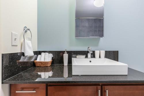 a bathroom with a white sink and a counter at Loop 1BR w Gym Pool WD nr Financial District CHI-238 in Chicago