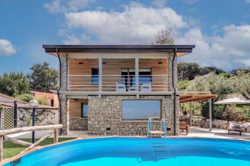 a house with a pool in front of it at Maison Annie - Mental Wellness Retreats in Sorrento