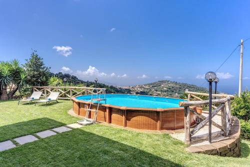 a swimming pool in a yard with a lawn at Maison Annie - Mental Wellness Retreats in Sorrento