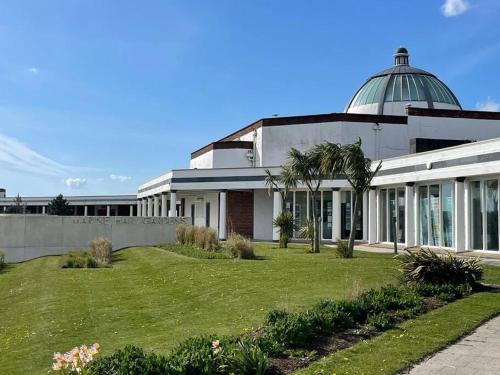 a large building with a dome on top of it at Lighthouse View - Lovely 3 bed 1st floor apartment in Fleetwood