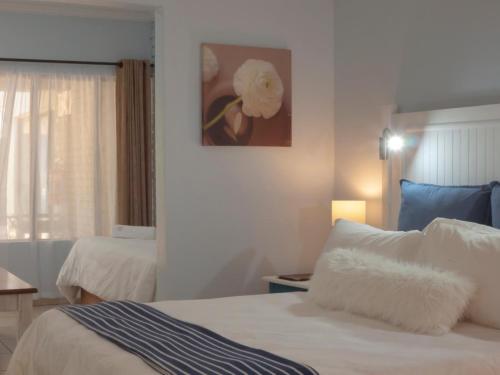 Ένα ή περισσότερα κρεβάτια σε δωμάτιο στο St. Lucia Safari Lodge