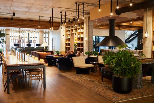 a restaurant with tables and chairs and a lobby at The Junto in Columbus