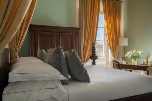 Cama o camas de una habitación en Loggiato Dei Serviti