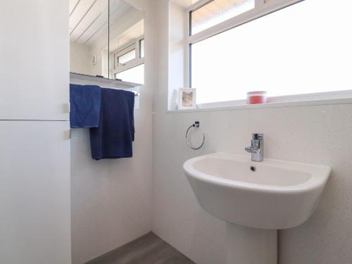 a bathroom with a sink and a window at 26 North Promenade in Cleveleys