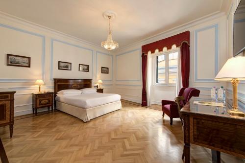 Postel nebo postele na pokoji v ubytování Hotel Quirinale