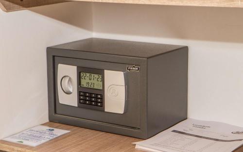 a small microwave oven sitting on top of a table at Best Western Patagonia in Puerto Natales