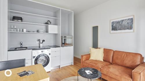 a living room with a couch and a table at Thingholt Hotel Apartments from Center Hotels in Reykjavík