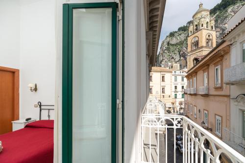 a balcony with a view of a building at Hotel Fontana in Amalfi