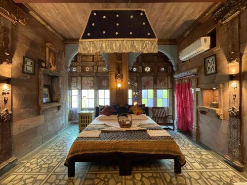 a bedroom with a large bed in a room at The Arch Boutique Home stay in Jodhpur