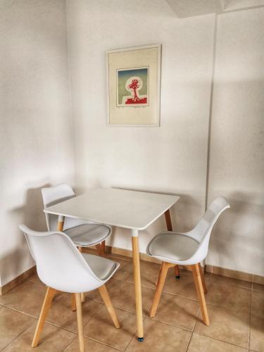 a table and two chairs in a room at Flemigks 1 bedroom appartement in Larnaka