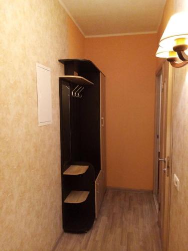 a black cabinet in the corner of a room at Makij apartment for night 2 in Narva
