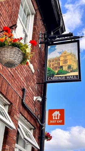 a street sign on the side of a brick building at The Cabbage Hall Hotel in Liverpool