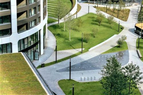 an aerial view of a park next to a building at Prestigious SKY PARK apartment - top city view - Traveller awards 2024 in Bratislava