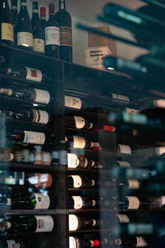 a room filled with lots of bottles of wine at Casa Nicolini in Barbaresco
