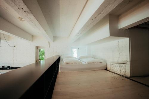 a room with a bed in the middle of it at Smaltovňa Loft D in Lučenec