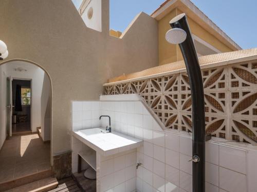 a bathroom with a sink and a shower at Casa Marcelo, charming and renovated house in Antigua