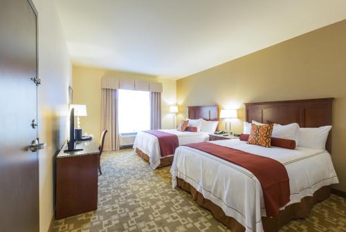 Postel nebo postele na pokoji v ubytování Boomtown Casino and Hotel New Orleans