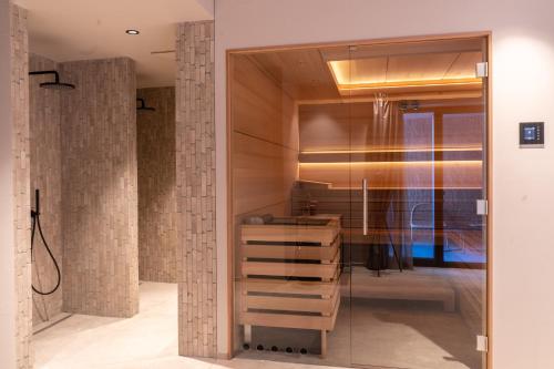 a bathroom with a sink and a mirror at HERBERT - Boutique Apartments inkl Lungau Card in Katschberghöhe