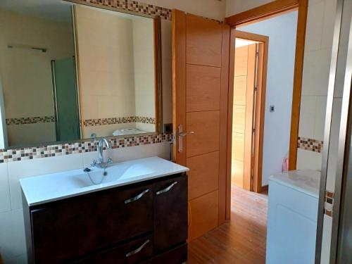 a bathroom with a sink and a mirror at Encantos de Cazorla in Cazorla