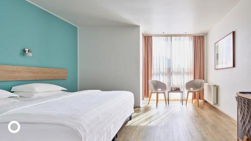 Postel nebo postele na pokoji v ubytování Center Hotels Plaza