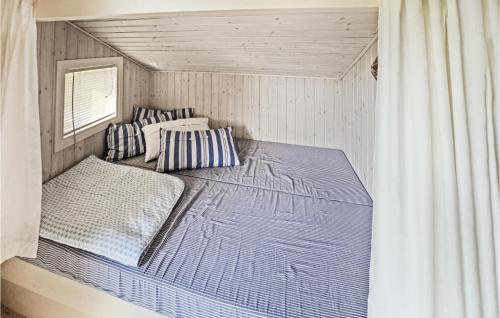 a room with two bunk beds in a house at Holiday Home Otterup With Sauna 303 in Otterup
