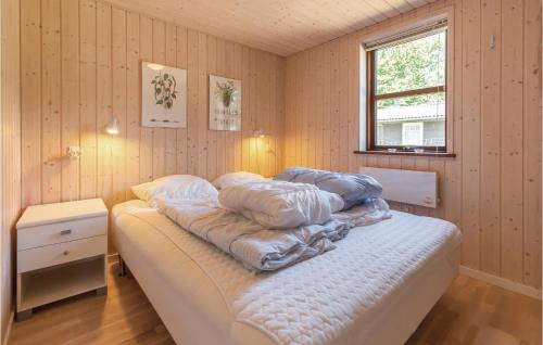 a bedroom with a bed with pillows on it at Gorgeous Home In Slagelse With Kitchen in Slagelse