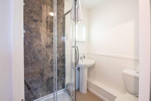 a bathroom with a shower and a sink at Isis Lakes 09, ArtHouse in South Cerney