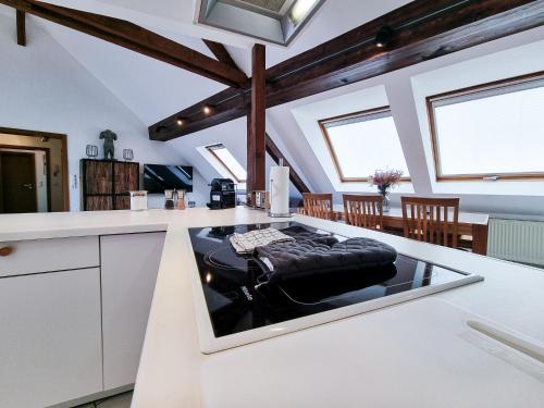a kitchen with a black couch on a counter at Alpha Apartments in Essen