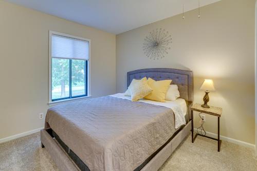 a bedroom with a bed and a window at Lakefront Michigan Rental with Kayak and Fire Pit 