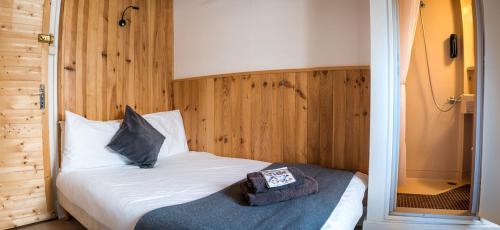 a bedroom with a bed with a pillow on it at Nant Morzine in Morzine