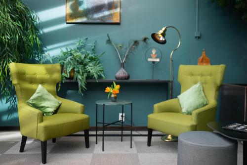 two chairs and a table in a room at Quality Hotel Winn Haninge in Haninge